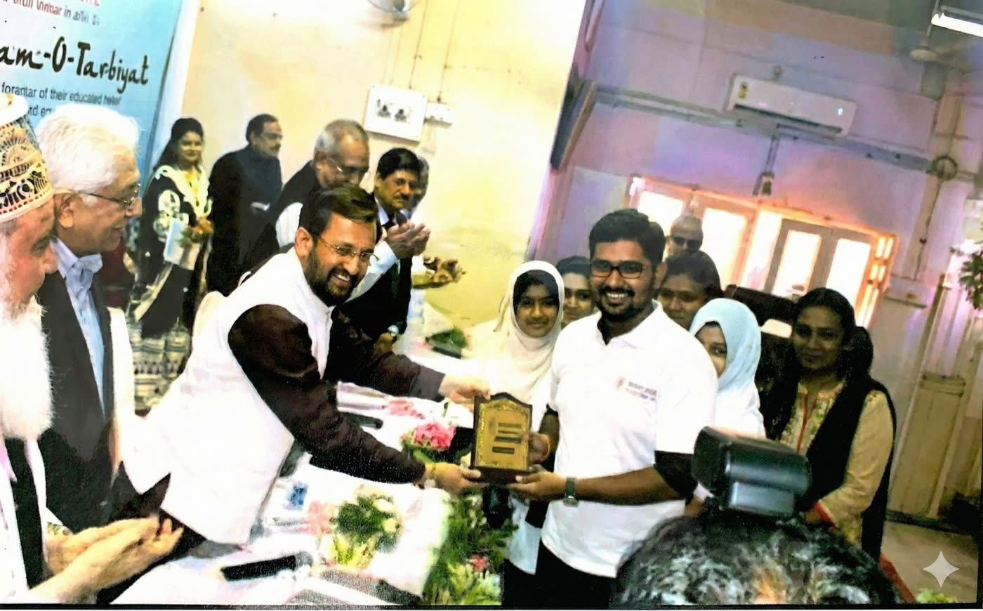 Ali receiving an award from dignitaries