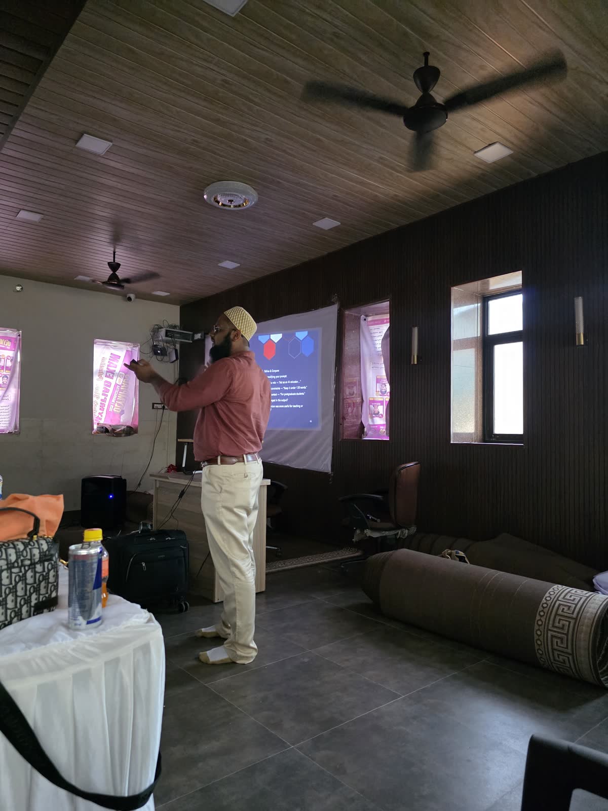 A trainer at the screen in Arambagh