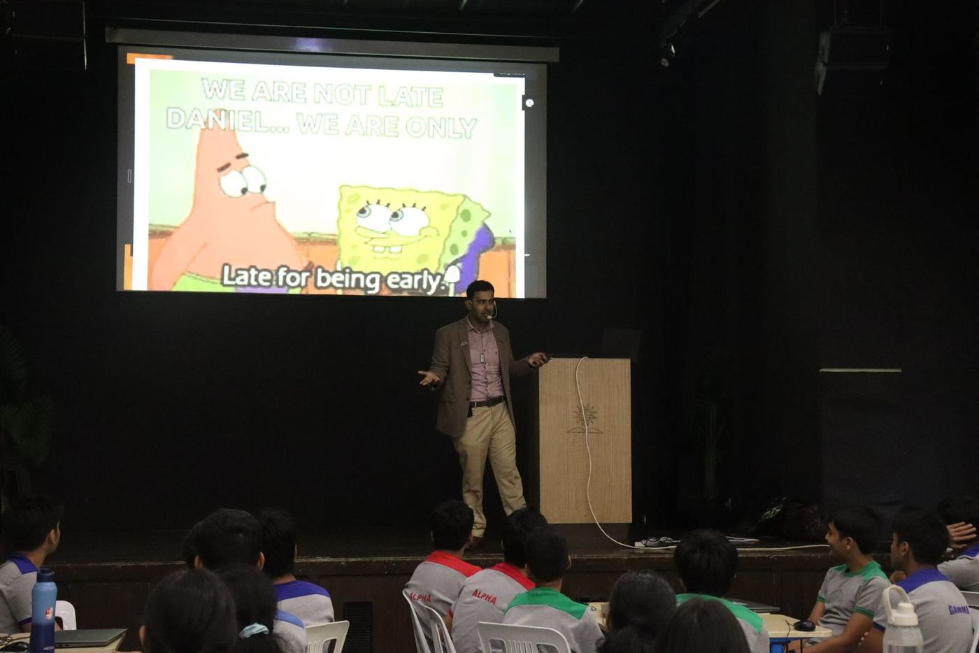 Ali on stage with a SpongeBob slide