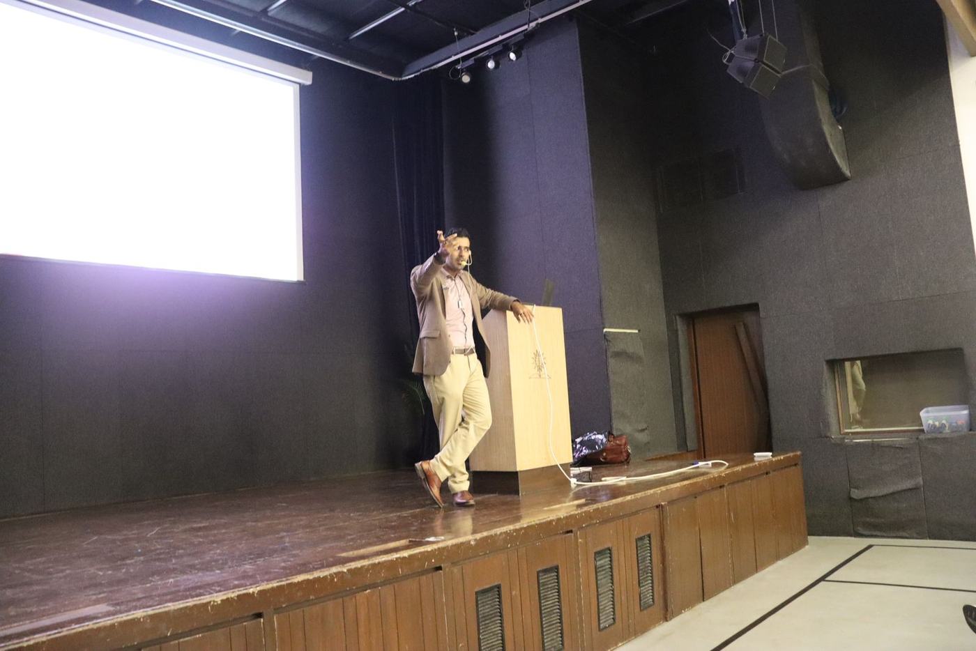 Ali presenting from the stage