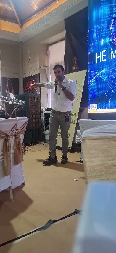 Presenting on stage at the Dongri bootcamp