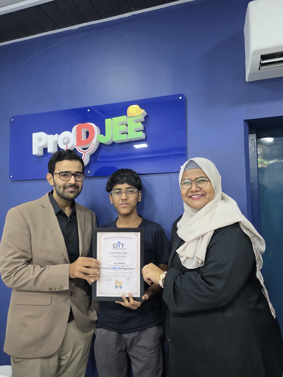 Another graduate receiving a certificate from Ali
