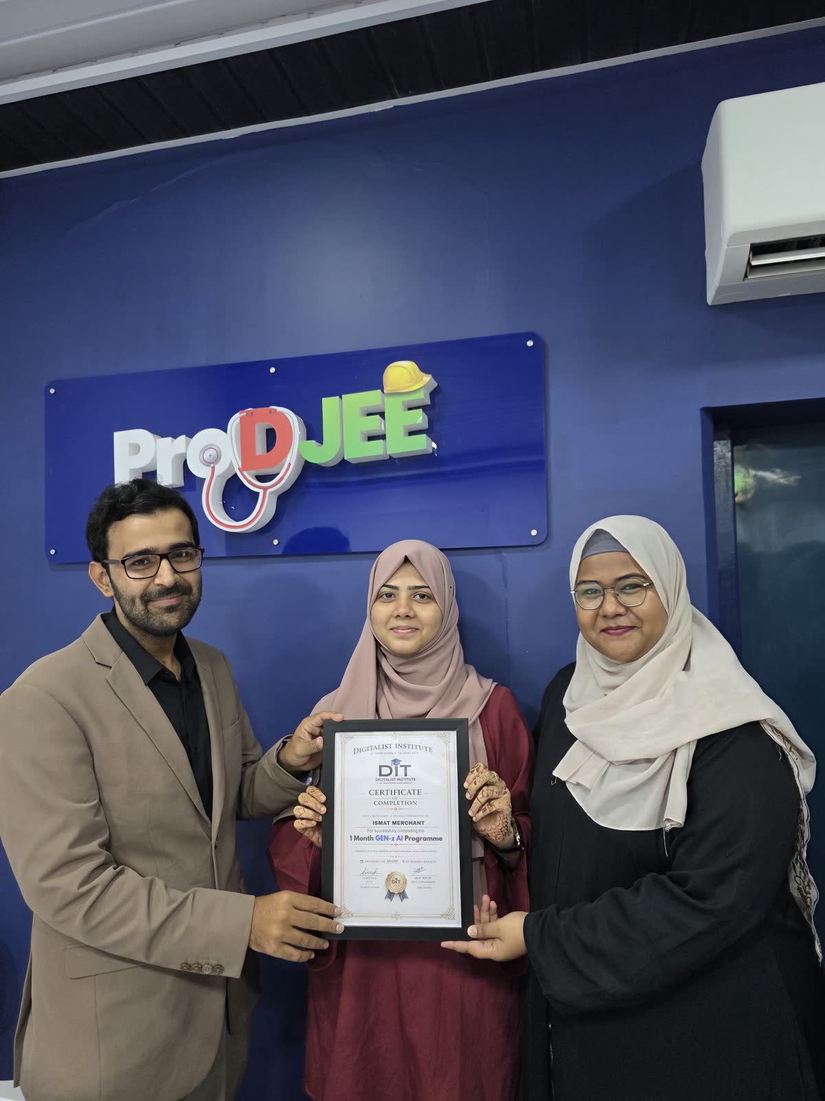A graduate with Ali and the programme mentor
