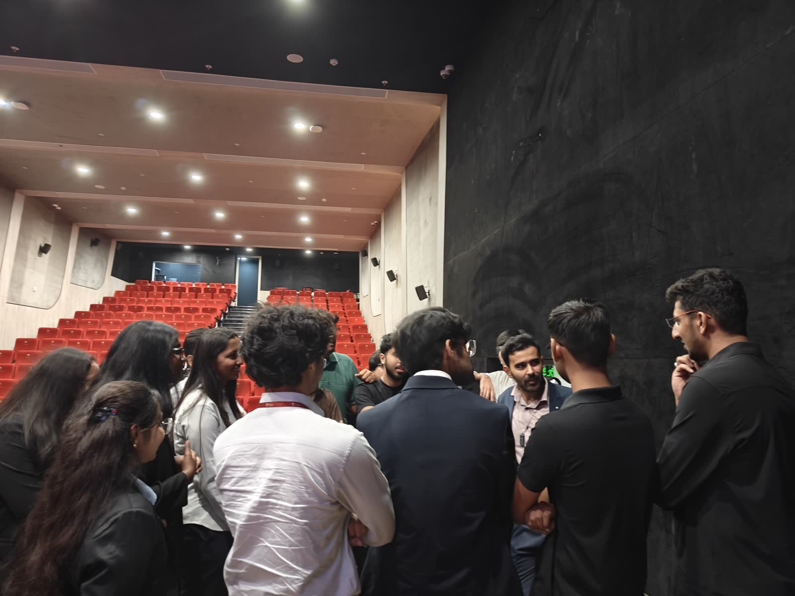 Students gathering around Ali after the NMIMS talk
