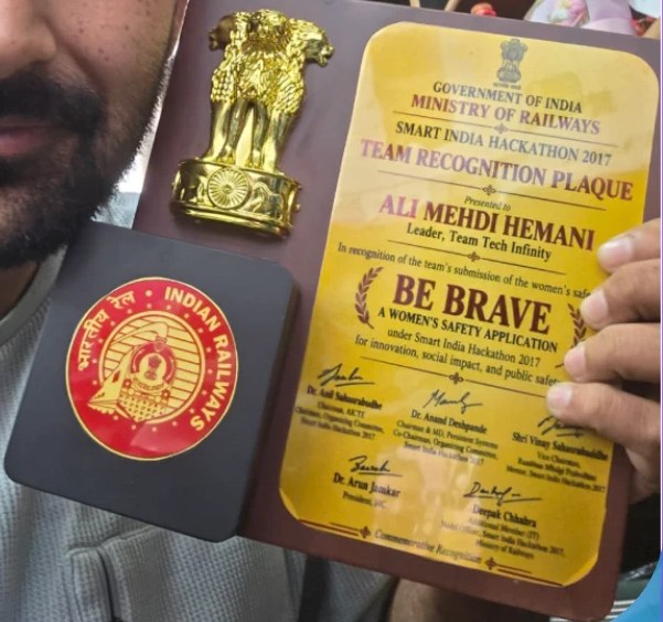 Ali holding the Ministry of Railways team recognition plaque from Smart India Hackathon 2017