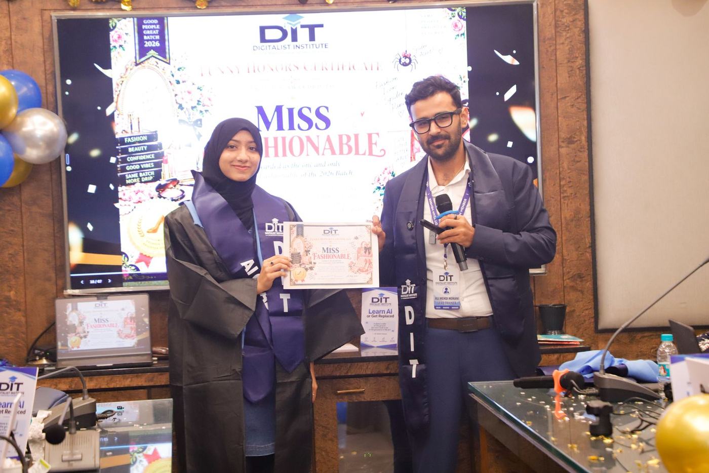 A graduate receives the Miss Fashionable award