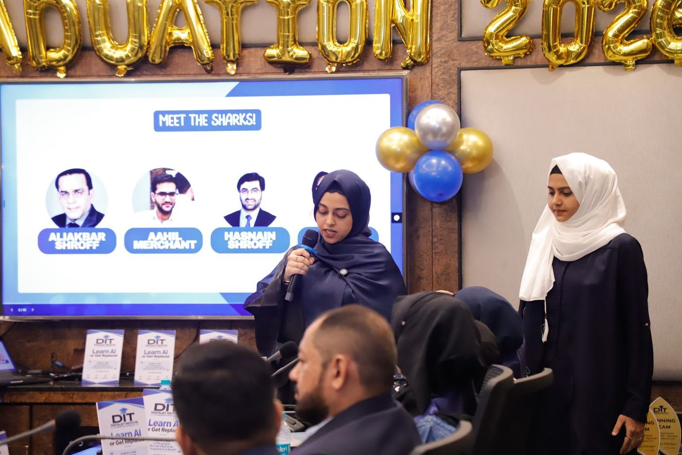 A graduate introducing the Sharkathon judges