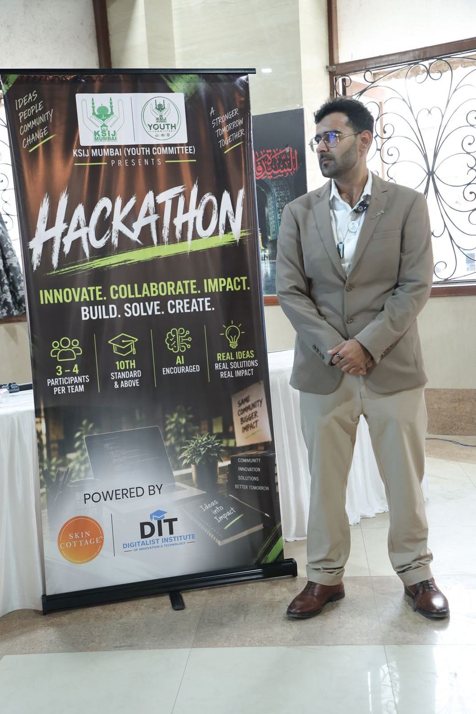 Ali at the Hackathon 2026 banner