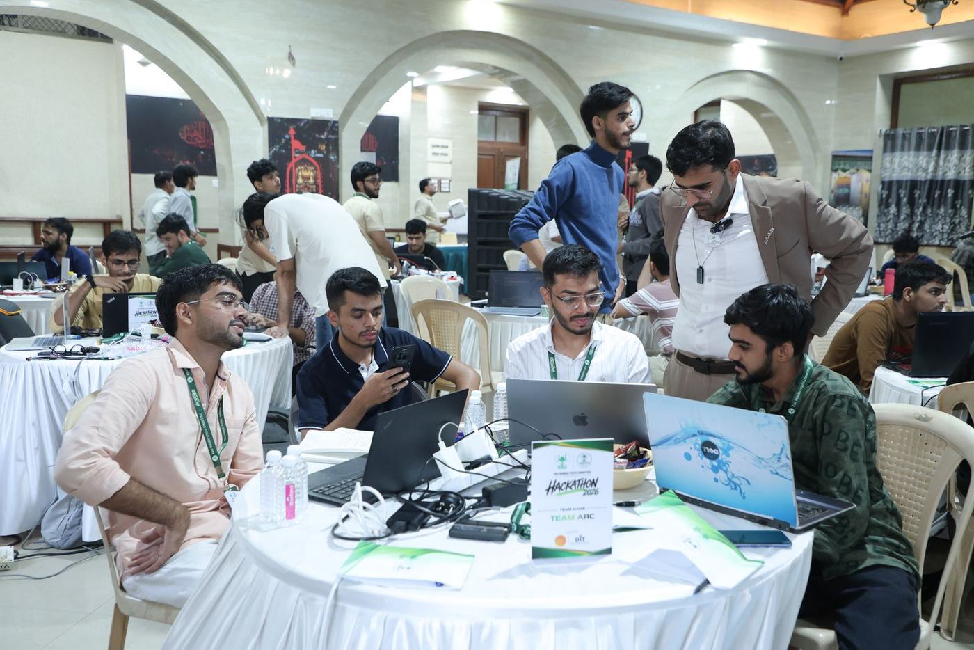 Teams heads-down at the hackathon